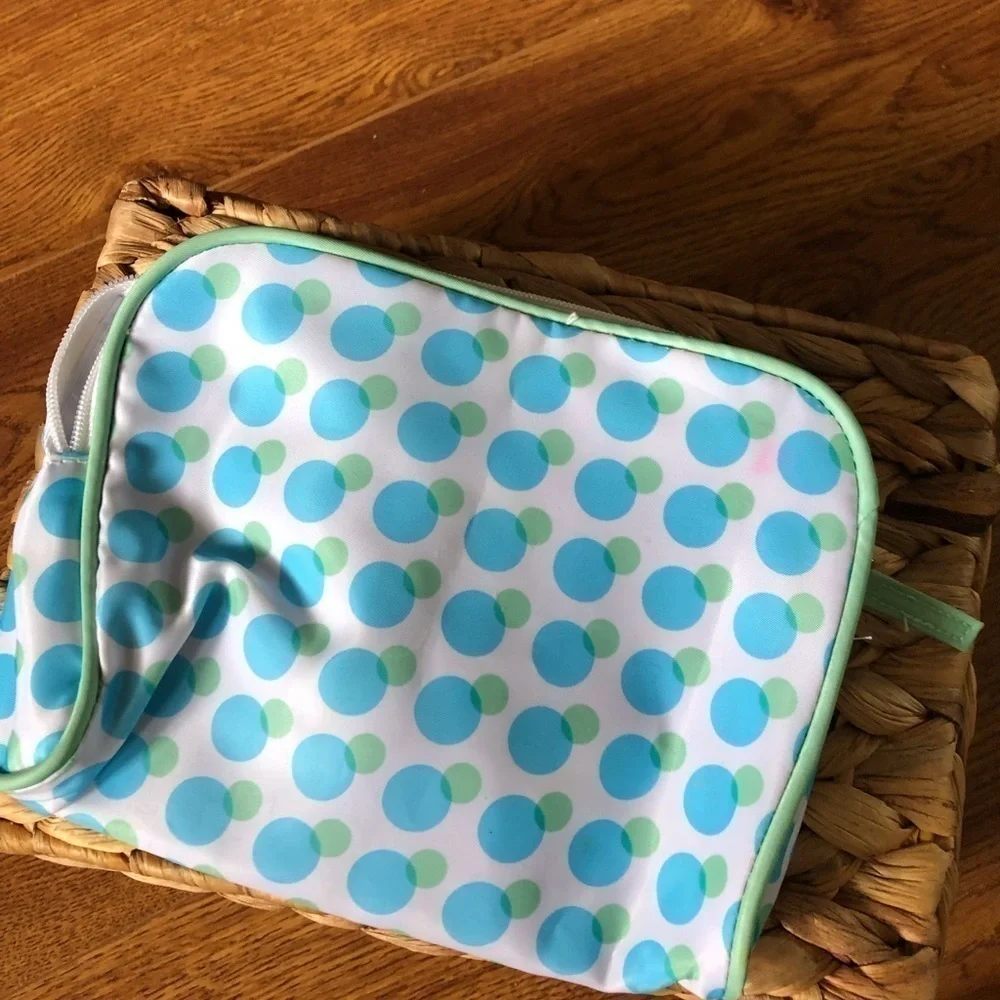 Medium size white and blue polka dot cometic bag